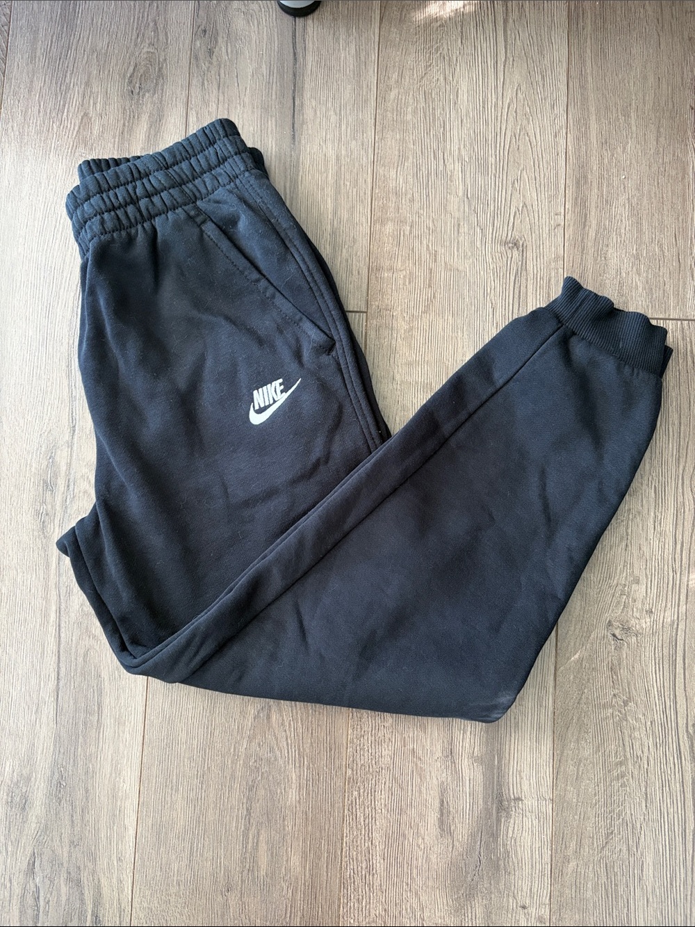 Nike Kids Black Jogger Sweatpants with White Swoosh. Boys size large